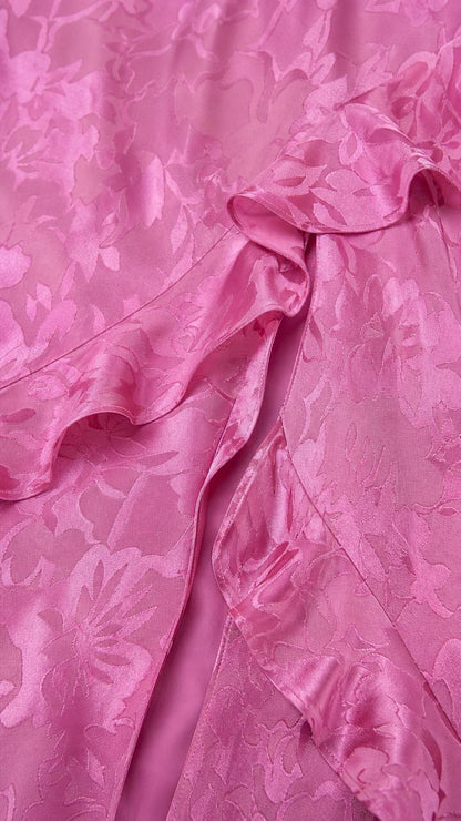 Close-up detail of tonal floral jacquard texture and ruffles