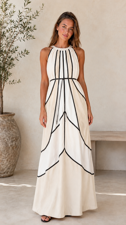 Front view of ivory halter maxi dress with black contrast piping