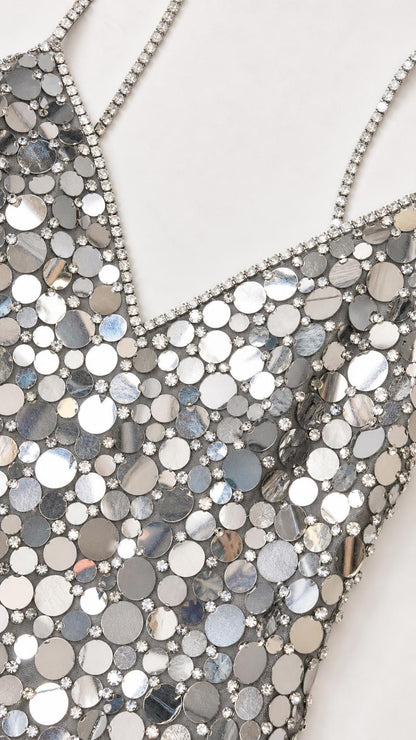 Close-up of mirrored sequin pattern and rhinestone straps