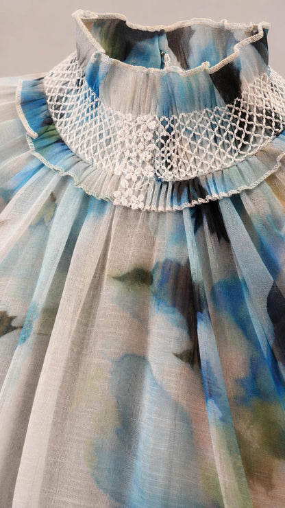 Close-up detail of high lace ruffle collar and pleated bodice