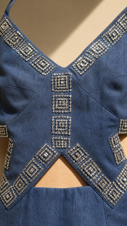 Close-up of rhinestone embellishments and waist cutouts