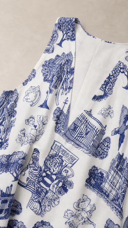 Close-up detail of blue Toile de Jouy fabric and V-neckline