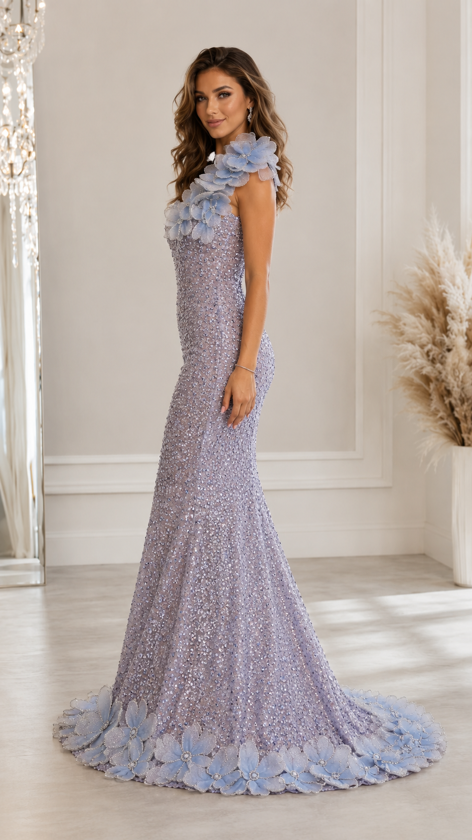 Side view of dusty blue fitted mermaid gown with floral shoulder detail