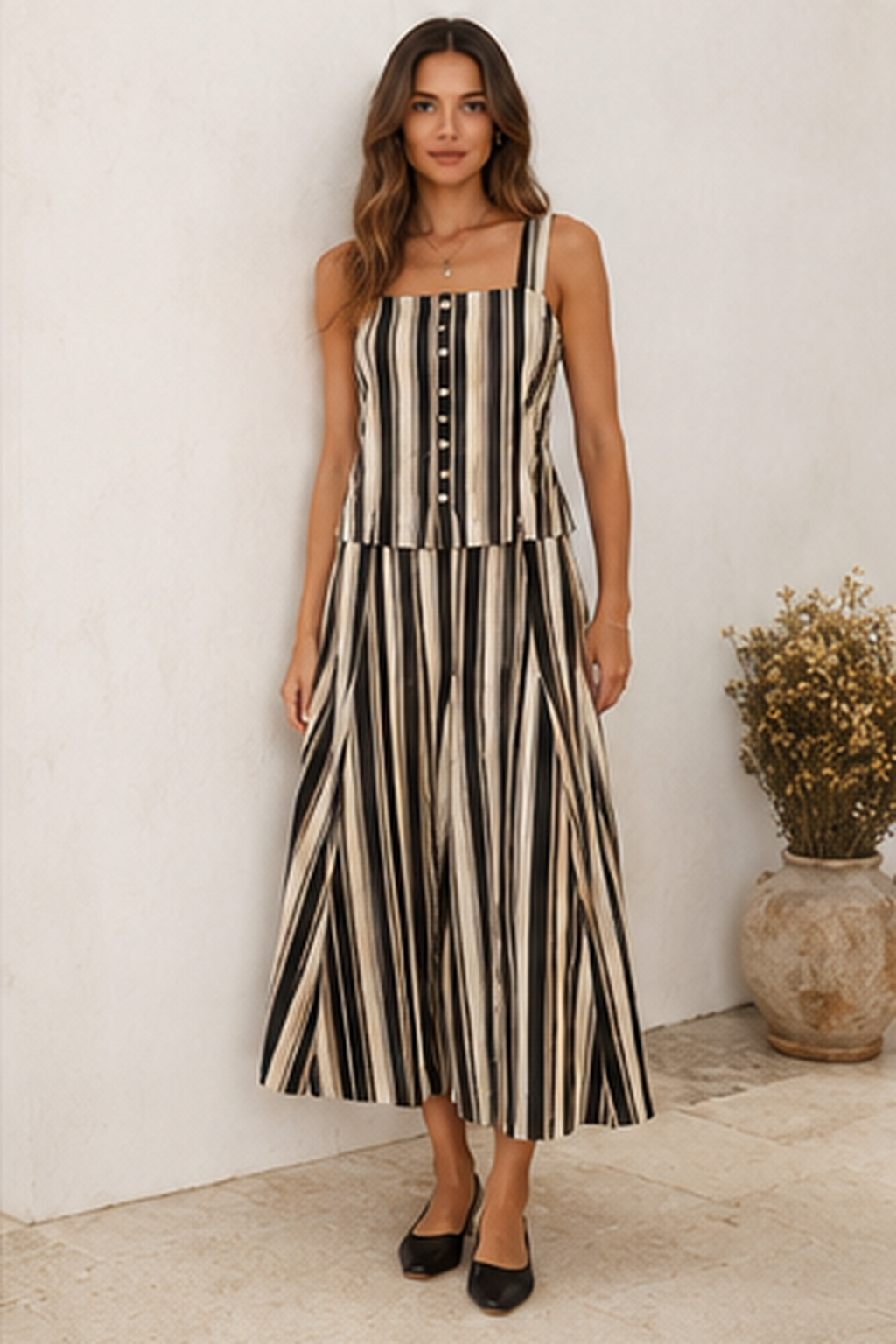 Black striped sleeveless top and wide-leg pants matching set