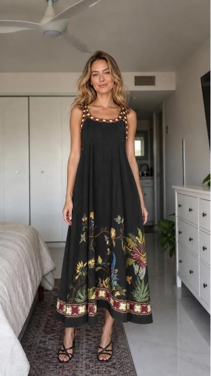 Woman wearing black boho floral embroidered maxi dress