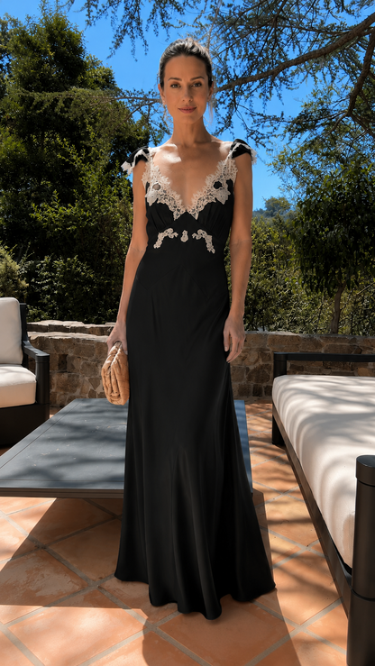 Front view of black lace trim maxi dress with ruffle straps
