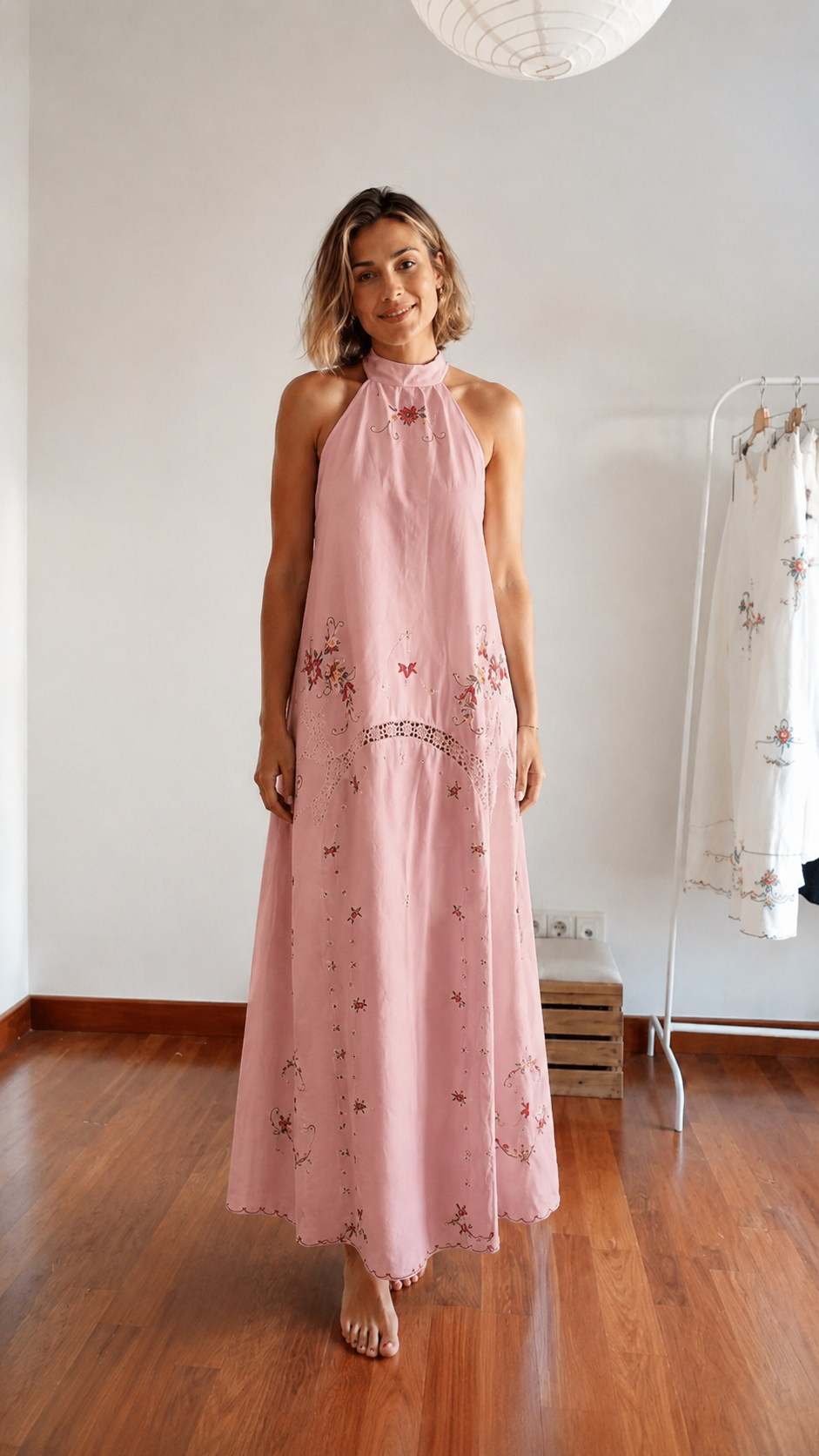 Front view of blush pink embroidered halter maxi dress