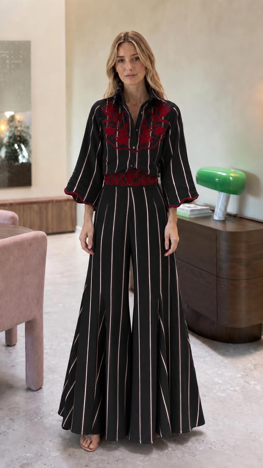 Front view of black striped embroidered wide leg jumpsuit