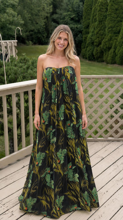 Model wearing black floral strapless maxi dress