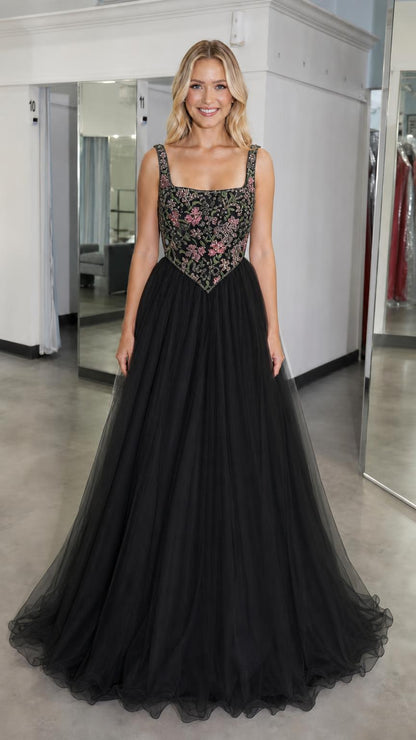 Front view of black embroidered bodice tulle ball gown