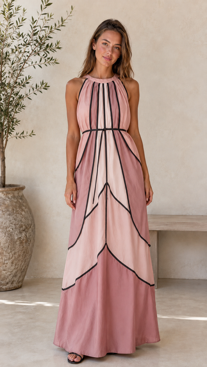 Front view of blush pink halter maxi dress with contrast trim and flowing skirt