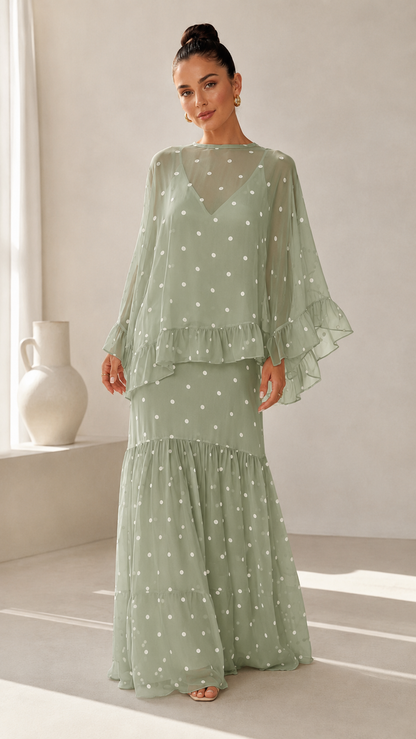 Sage green polka dot maxi dress with sheer draped sleeves and ruffle skirt