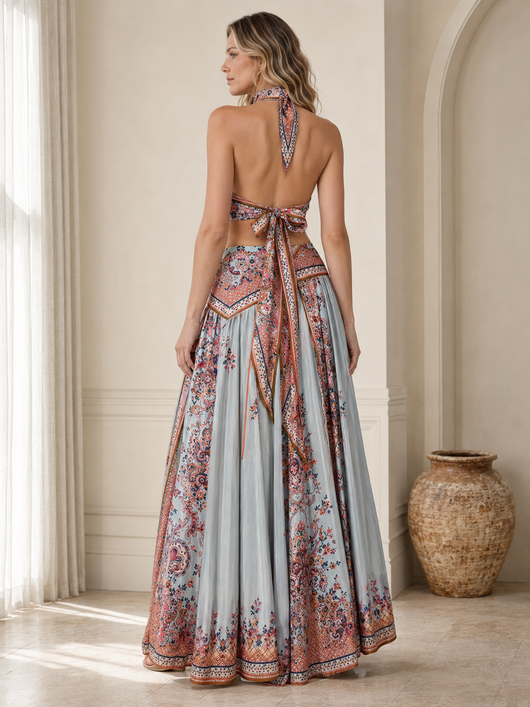 Back view of sky blue halter maxi dress with open back and tie closure