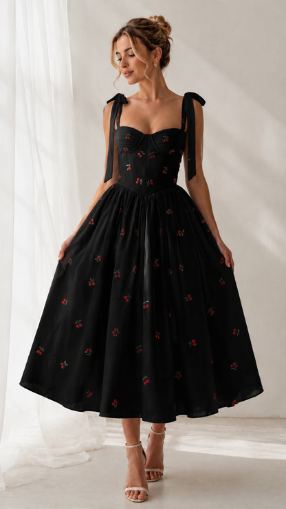 Front view of black cherry print tie-strap sweetheart midi dress