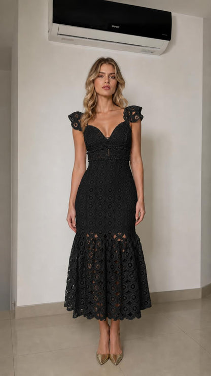 Front view of woman wearing black lace mermaid midi dress