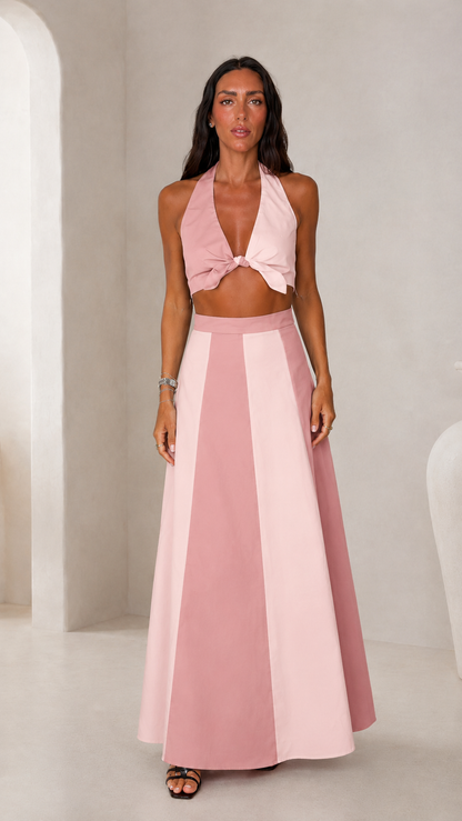 Front view of blush pink halter crop top and color block maxi skirt set