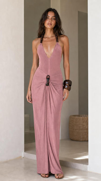 Model wearing dusty pink halter maxi dress