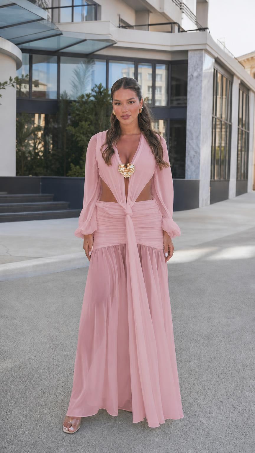 Woman wearing pink long sleeve cutout maxi dress, front view