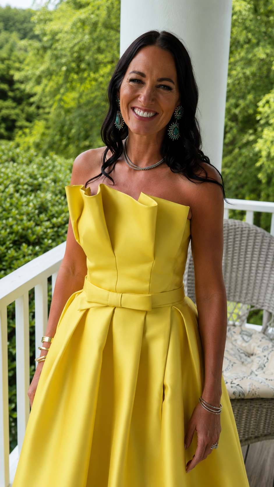 Close-up of yellow foldover neckline and waist detail on strapless gown