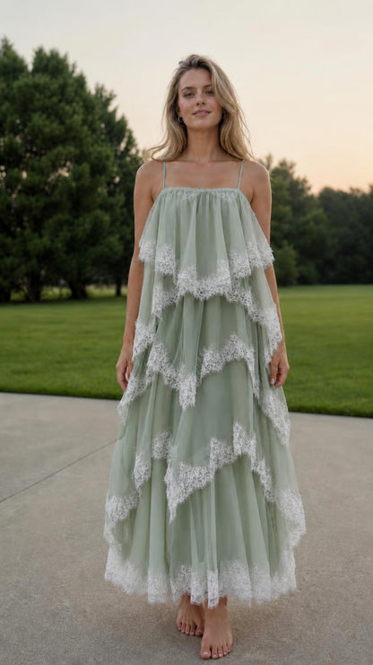 Front view of model wearing sage green tiered tulle maxi dress