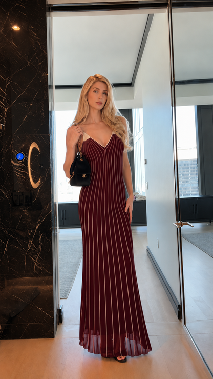 Front view of burgundy striped spaghetti strap mermaid maxi dress