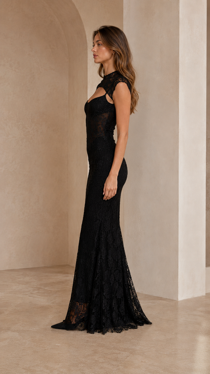 Side view of black lace mermaid gown with floor-length flared hem