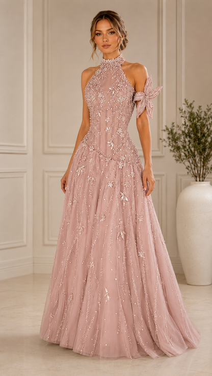 Front view of blush pink embellished halter evening gown with floral shoulder detail