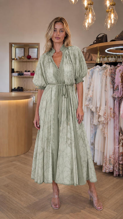 Front view of model wearing sage tie dye midi dress