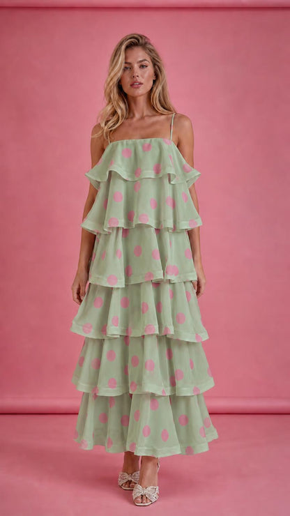 Model wearing sage green polka dot tiered ruffle midi dress