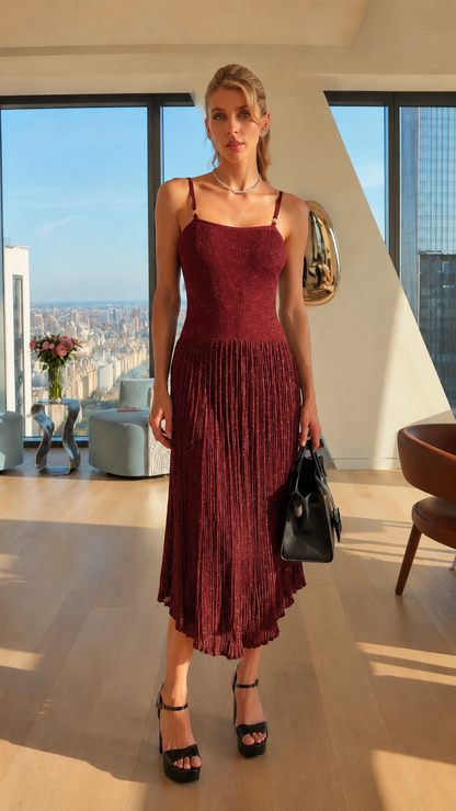 Front view of burgundy shimmer pleated midi dress with spaghetti straps