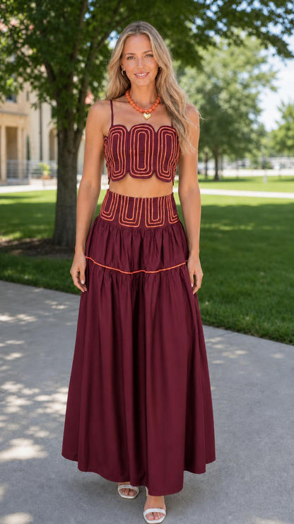 Front view of woman wearing burgundy embroidered two-piece set