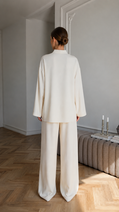 Women's cream two-piece lounge set back view with full-length wide leg pants