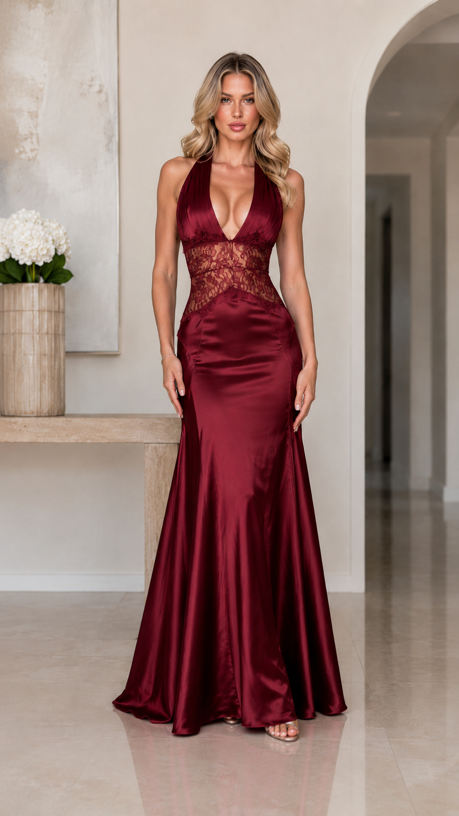 Front view of burgundy halter formal gown with lace waist and floor-length skirt