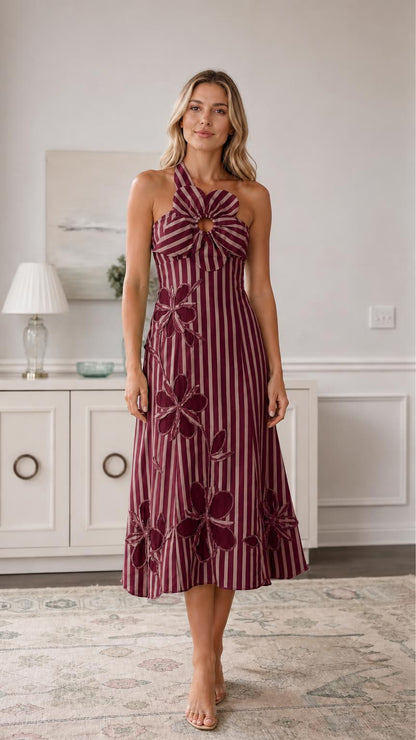 Front view of burgundy striped halter midi dress