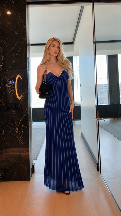 Front view of royal blue striped spaghetti strap mermaid maxi dress