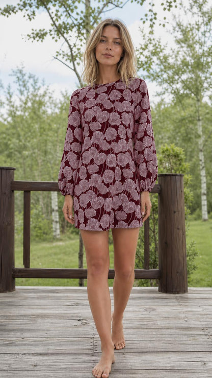 Front full view of woman wearing burgundy floral shift dress