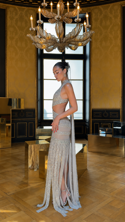 Side view of champagne sequin halter cutout mermaid evening gown
