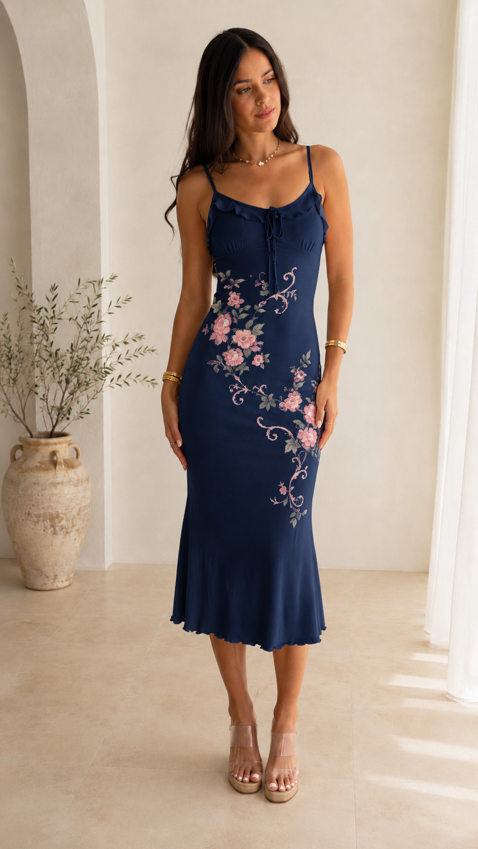 Front view of navy floral print slip midi dress with floral print and softly flared hem