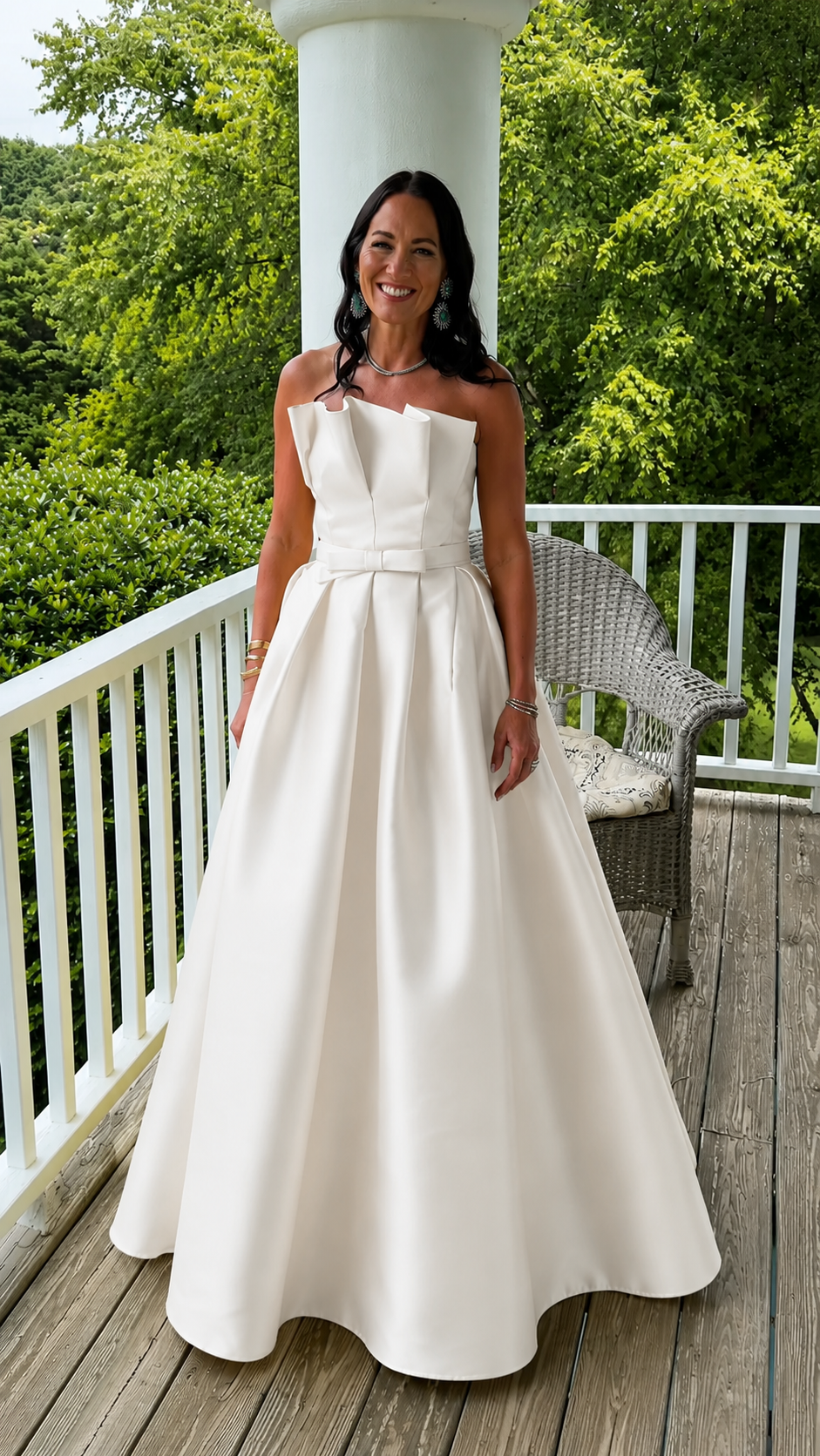 Front view of white strapless structured formal maxi gown