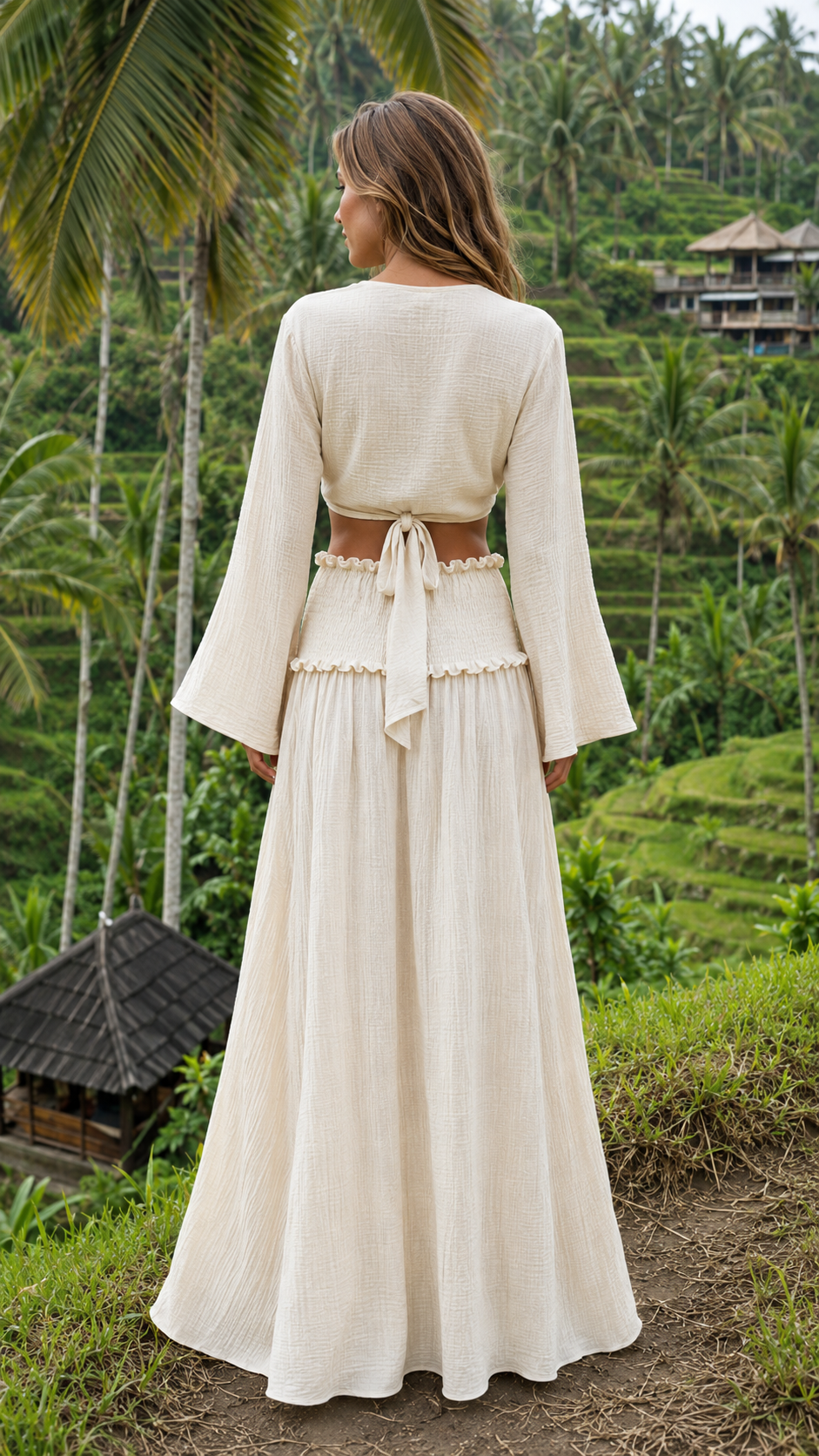 Back view of ivory crop top and maxi skirt set with tie-back detail