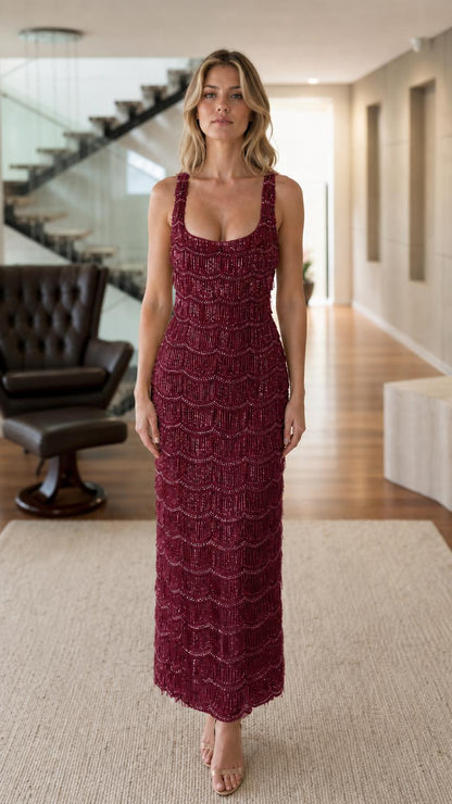 Front view of model wearing burgundy sequin maxi dress