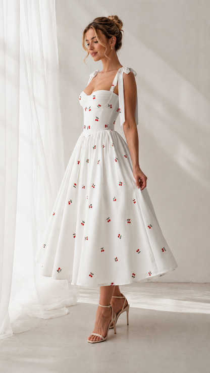 Angled front view of white cherry print fit-and-flare midi dress