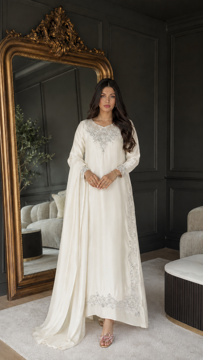 Front view of ivory embroidered maxi kaftan dress with matching draped layer