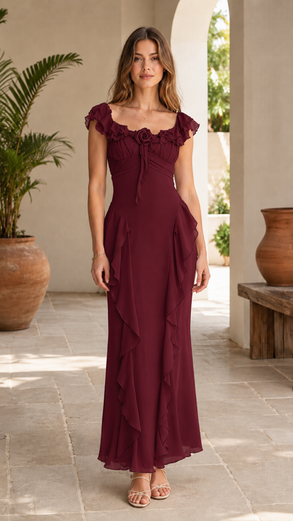 Front view of burgundy maxi dress with ruffle trim and soft drape
