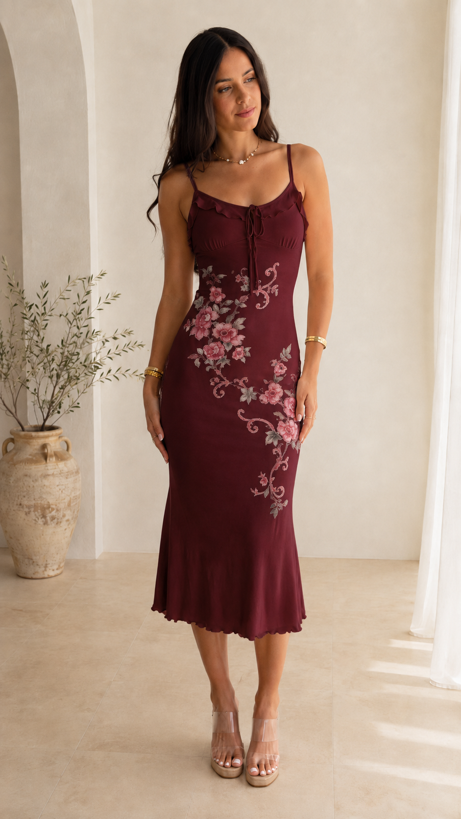 Front view of burgundy floral print slip midi dress with floral placement detail