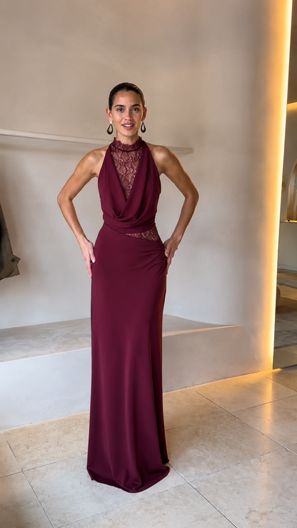 Front view of burgundy halter lace evening gown with fitted floor-length shape