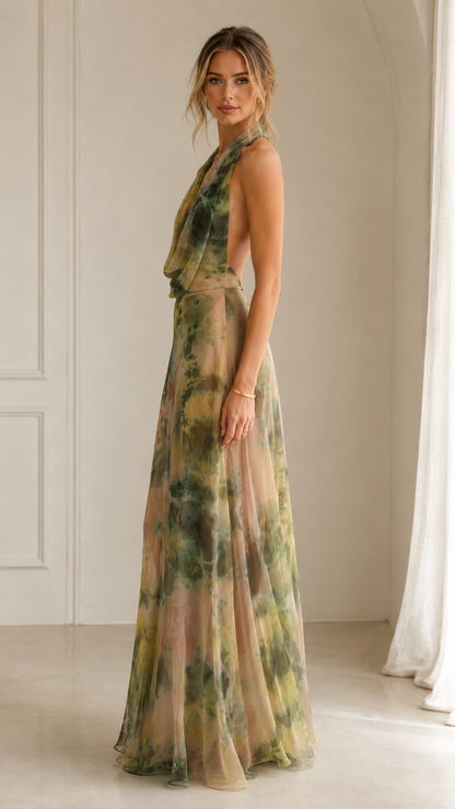 Side view of olive floral flowing maxi dress with open back