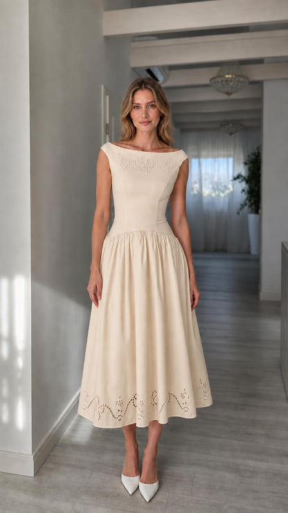 Full view of woman wearing champagne boatneck midi dress