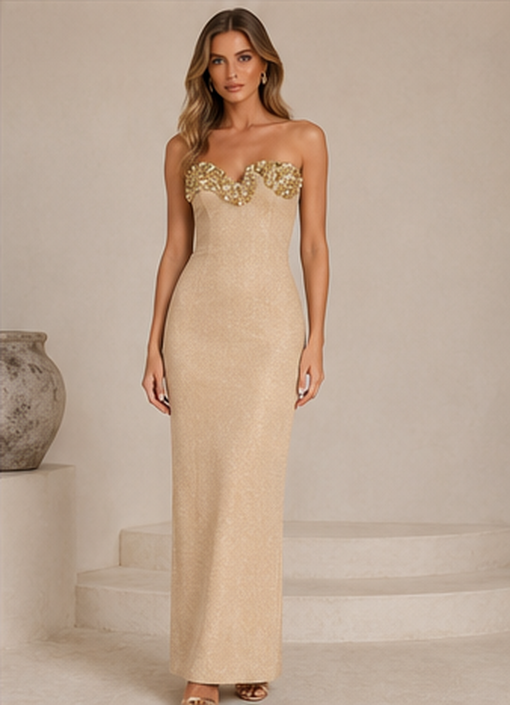 Front view of champagne strapless column maxi dress with embellished neckline