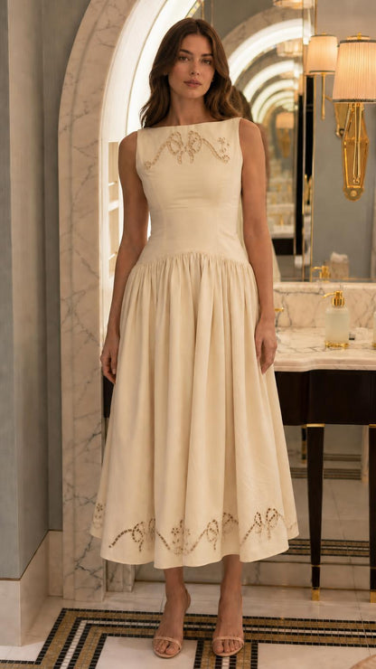 Front view of cream embroidered midi dress